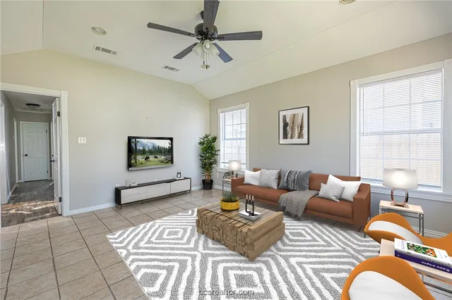 a living room with furniture and a window