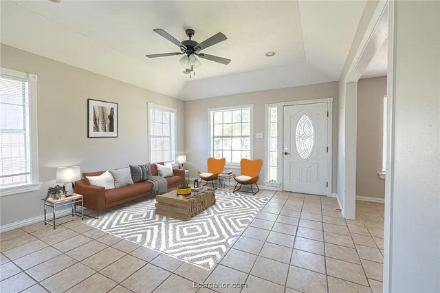 a living room with furniture and a window
