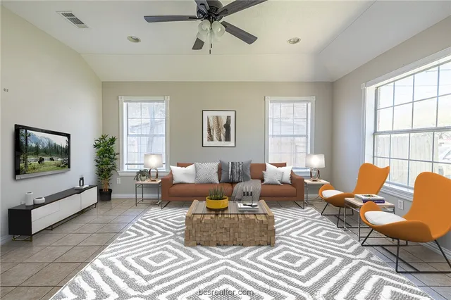 a living room with furniture or couch and a flat screen tv