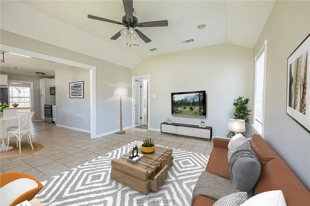 a living room with furniture and a rug