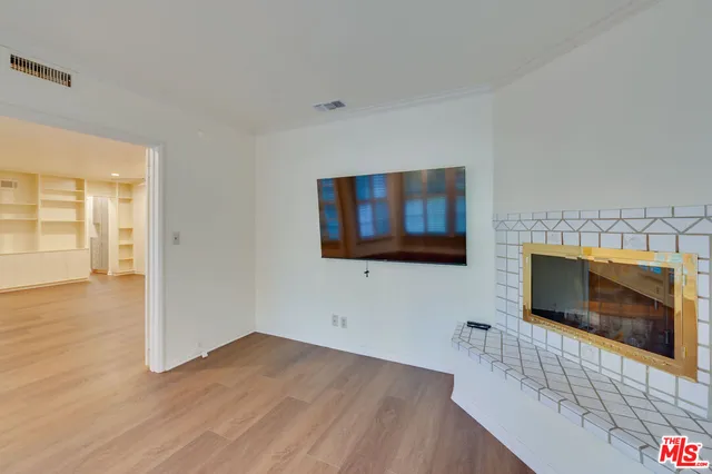 a view of room with window and cabinet
