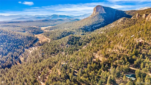a view of a city with mountains in the background