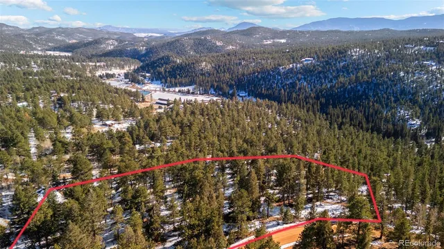 a aerial view of a house with a yard
