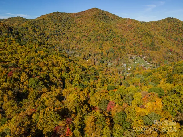 a view of a large mountain with mountains in the background