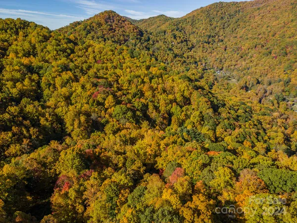 a view of a large mountain with a mountain in the background