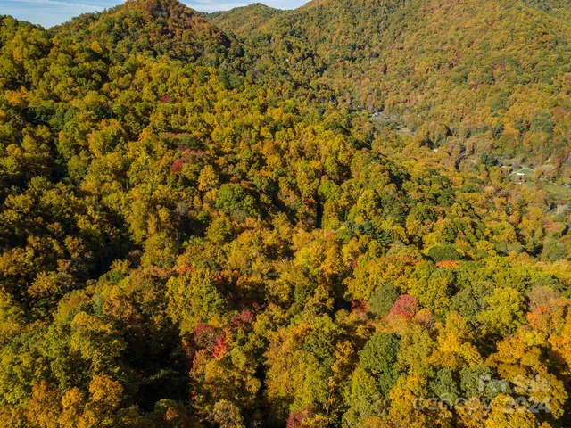 a view of a large mountain with a mountain in the background