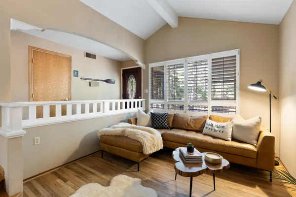 a living room with furniture and a large window