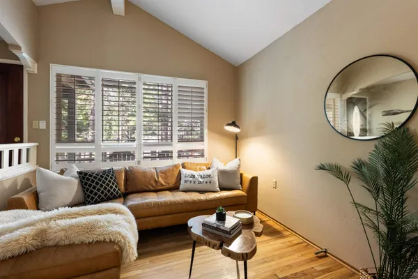 a living room with furniture and a large window