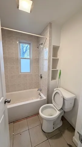 a bathroom with a toilet a sink and a bathtub