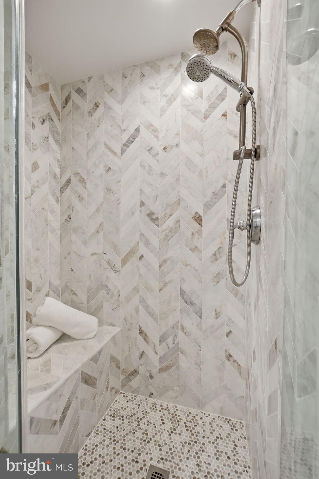 11990 Market Street, Unit 2103 Reston, VA 20190 - Photo 48 of 78 Elegant herringbone tile shower retreat.