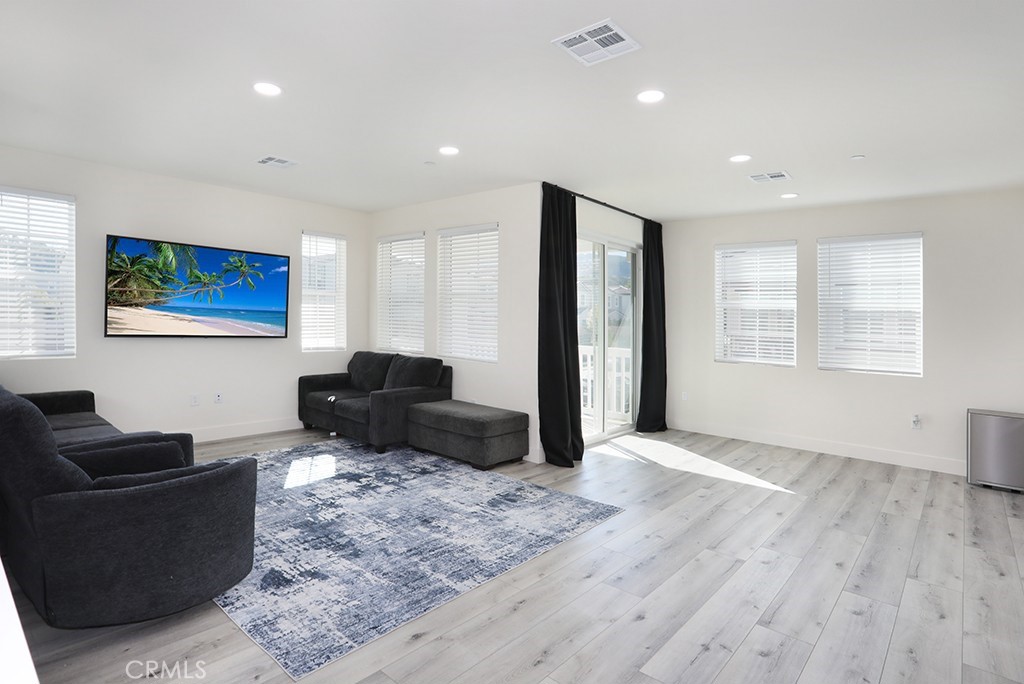 4067 Summer Corona, CA 92883 - Photo 16 of 28 a living room with furniture window and flat screen tv