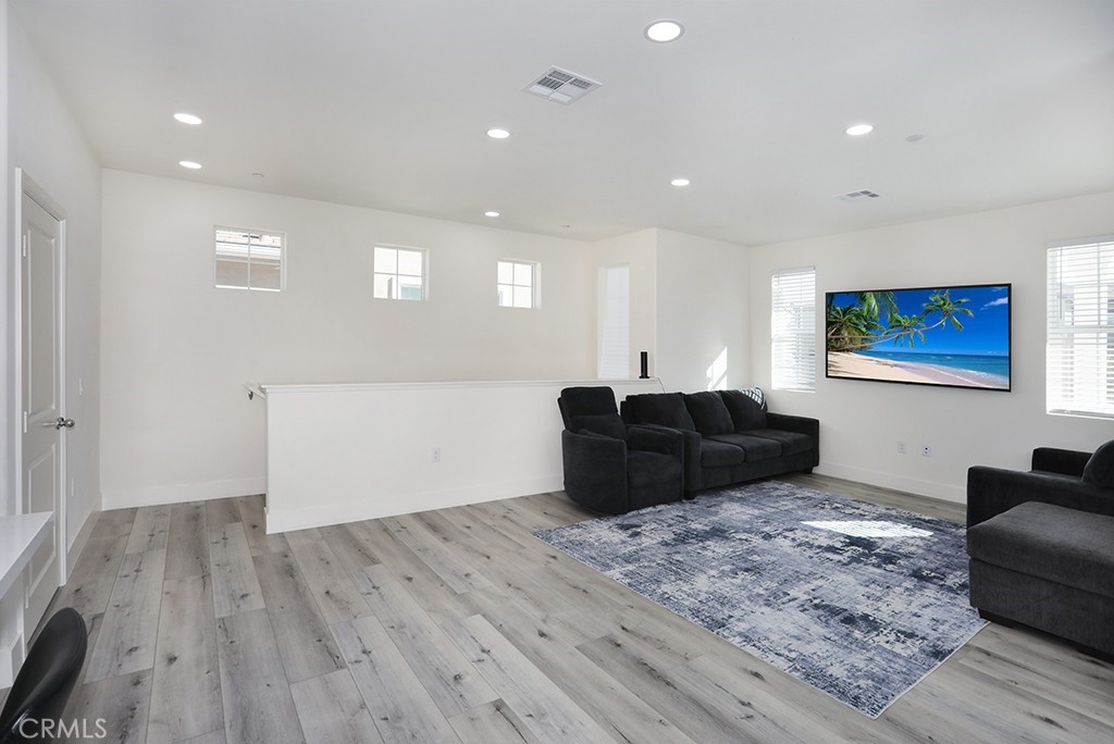 4067 Summer Corona, CA 92883 - Photo 17 of 28 a living room with furniture and a hard wood floor