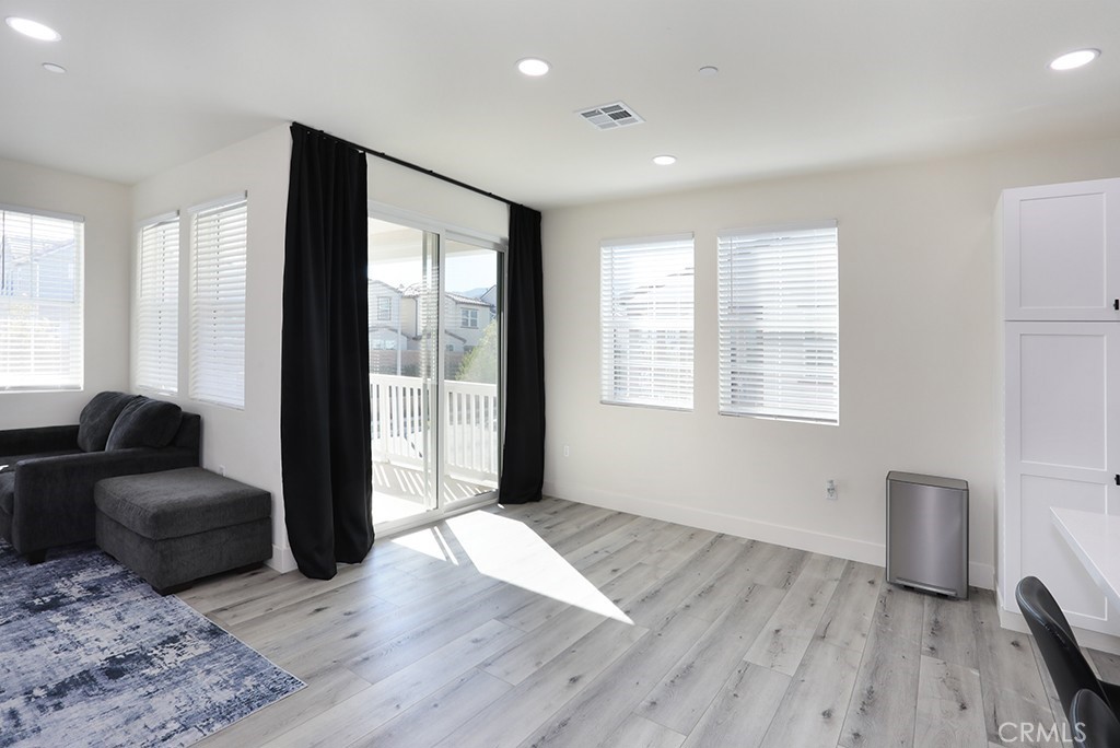 4067 Summer Corona, CA 92883 - Photo 18 of 28 a living room with furniture and wooden floor