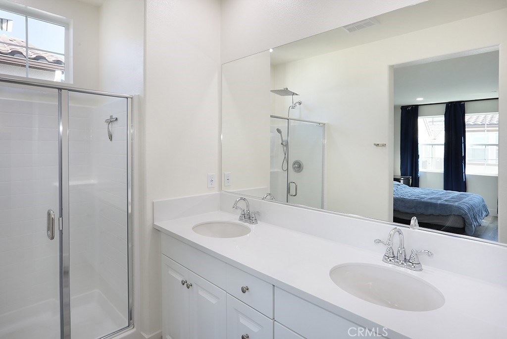4067 Summer Corona, CA 92883 - Photo 19 of 28 a bathroom with a sink and a mirror