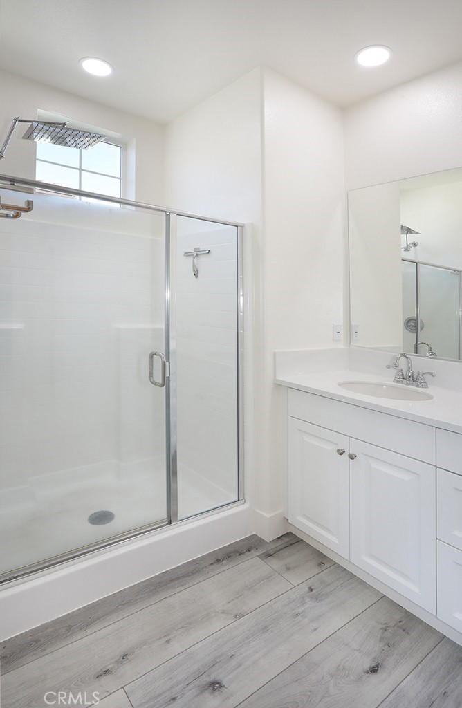4067 Summer Corona, CA 92883 - Photo 20 of 28 a bathroom with a shower sink and mirror
