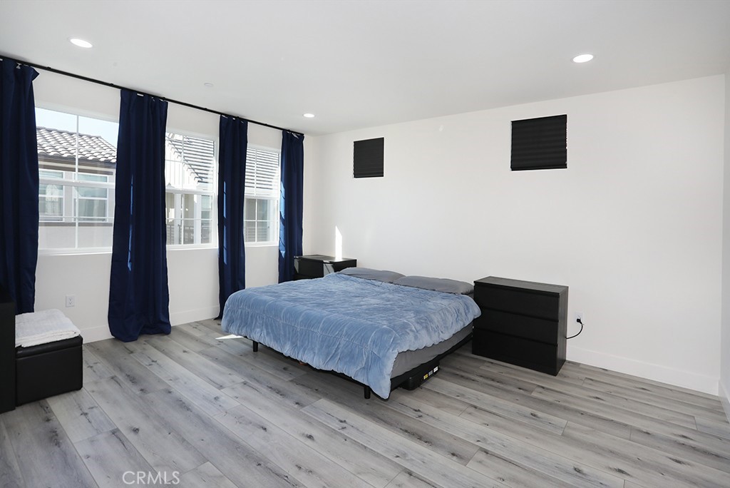 4067 Summer Corona, CA 92883 - Photo 21 of 28 a bedroom with a bed and large window