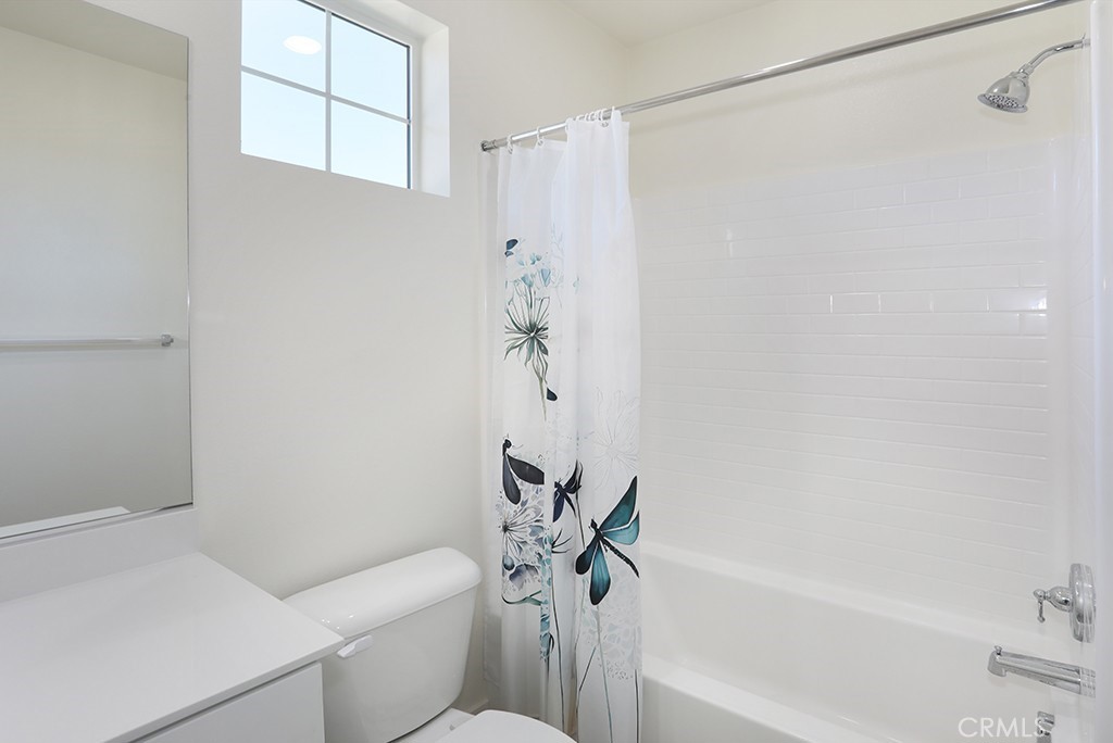 4067 Summer Corona, CA 92883 - Photo 27 of 28 a bathroom with a shower a toilet and a bathtub