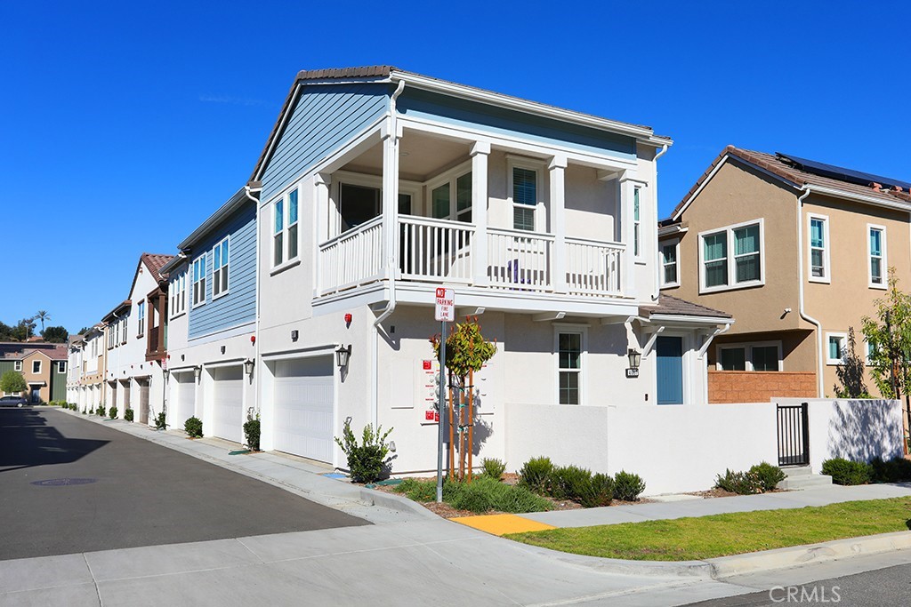 4067 Summer Corona, CA 92883 - Photo 4 of 28 a front view of a house with a yard