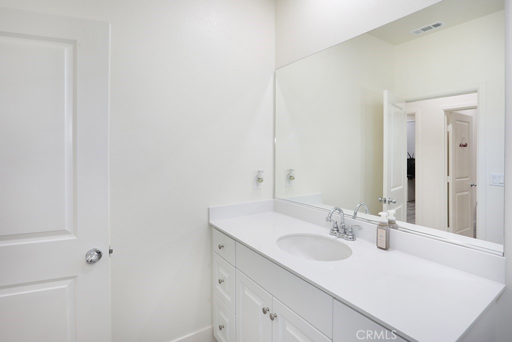 4067 Summer Corona, CA 92883 - Photo 5 of 28 a bathroom with a sink and a mirror
