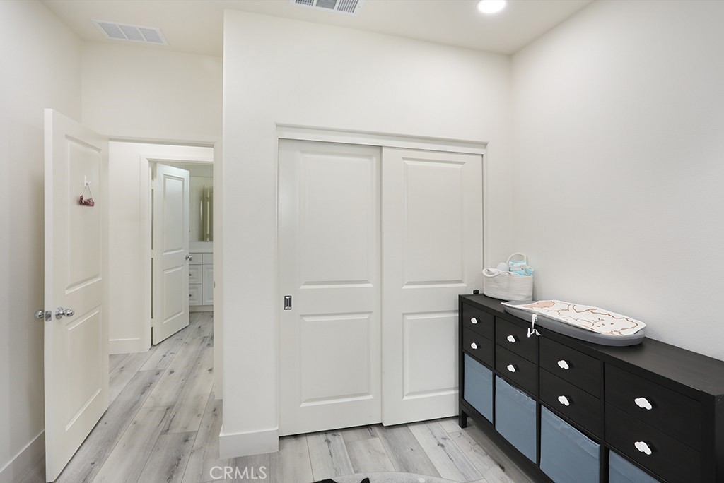 4067 Summer Corona, CA 92883 - Photo 7 of 28 a view of a hallway with wooden floor