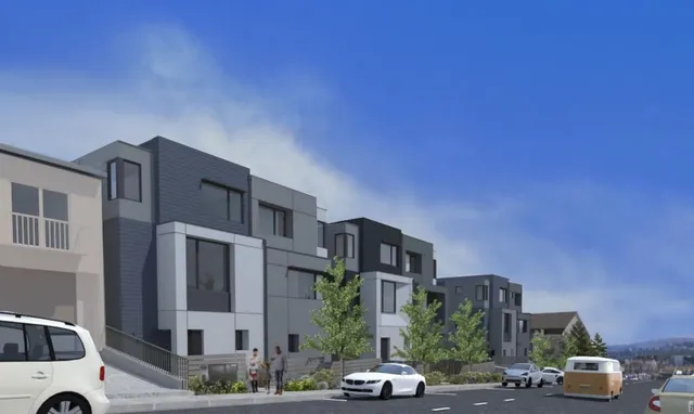 a city street lined with buildings and cars