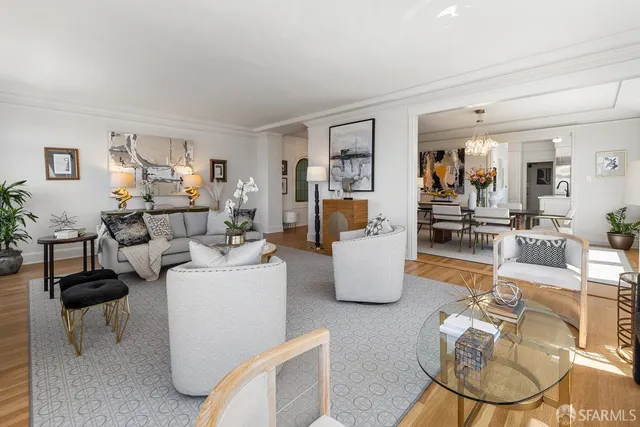 a living room with fireplace furniture and a wooden floor