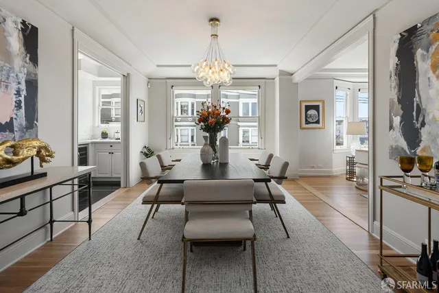 a living room with furniture a chandelier and a chandelier