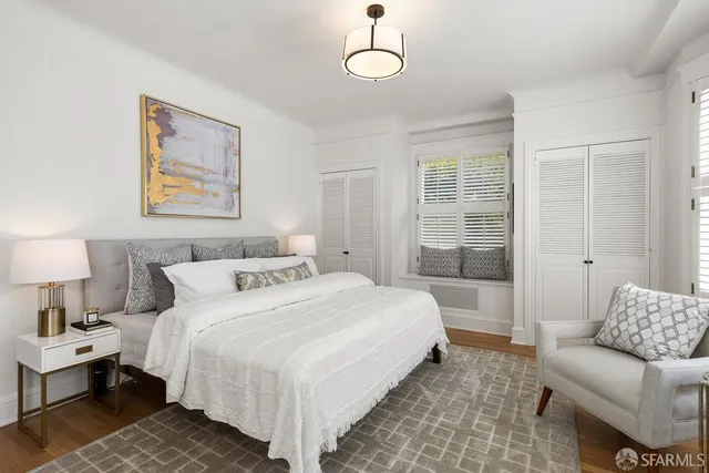 a bedroom with a bed and a couch