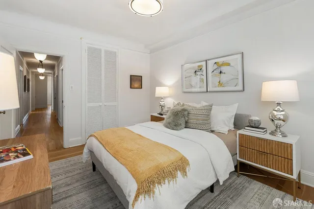 a bed room with a bed and a lamp