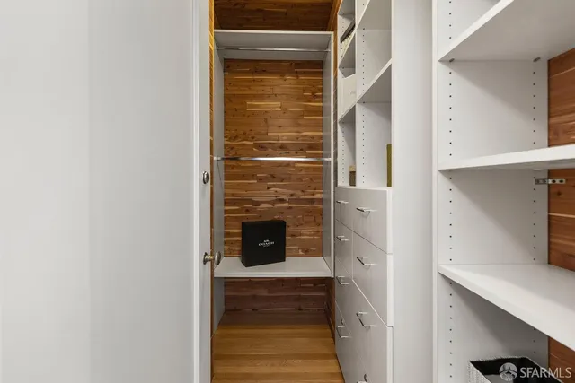 a bathroom with a walk in closet