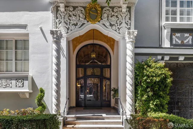 a front view of a house with a garden