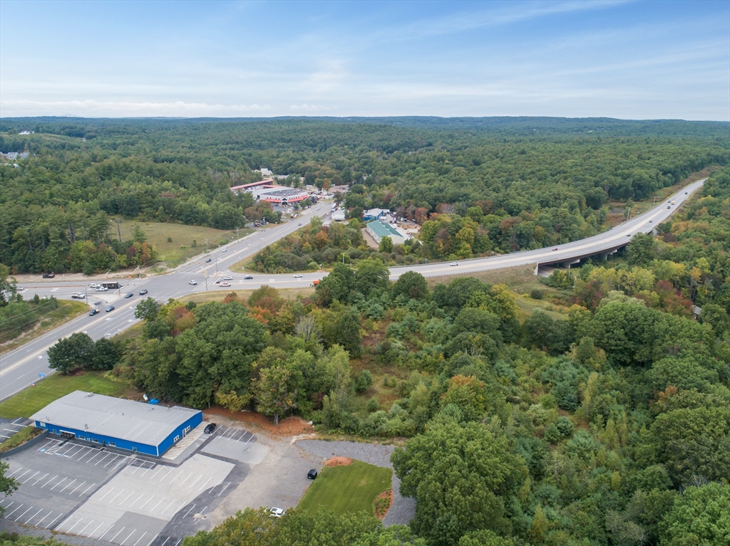 24 Rockingham Road Windham, NH 03087 - Photo 8 of 10 an aerial view of residential houses with outdoor space and trees