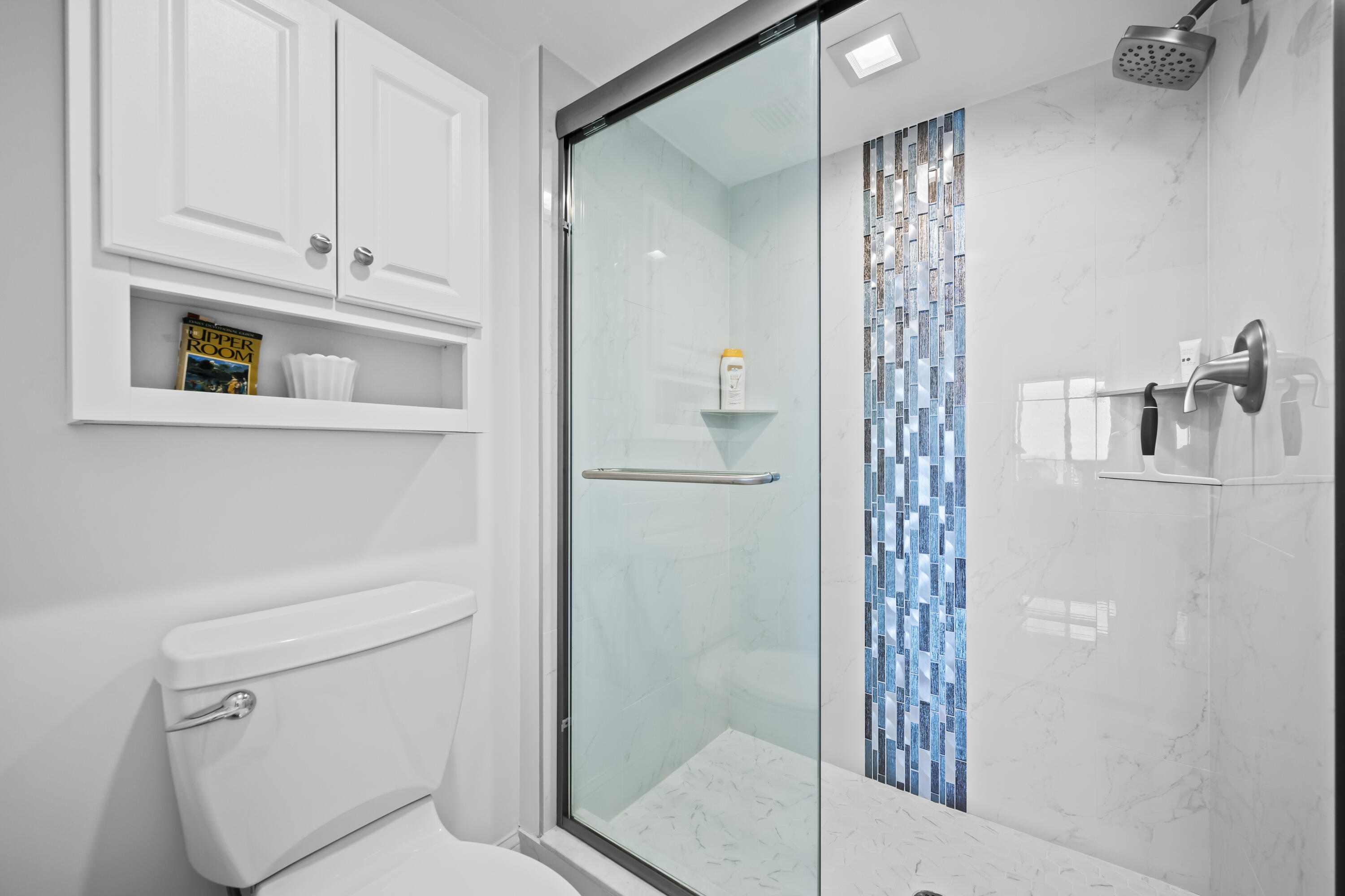 134 Lakeshore Drive, Unit 814 North Palm Beach, FL 33408 - Photo 15 of 30 a bathroom with a shower toilet and sink