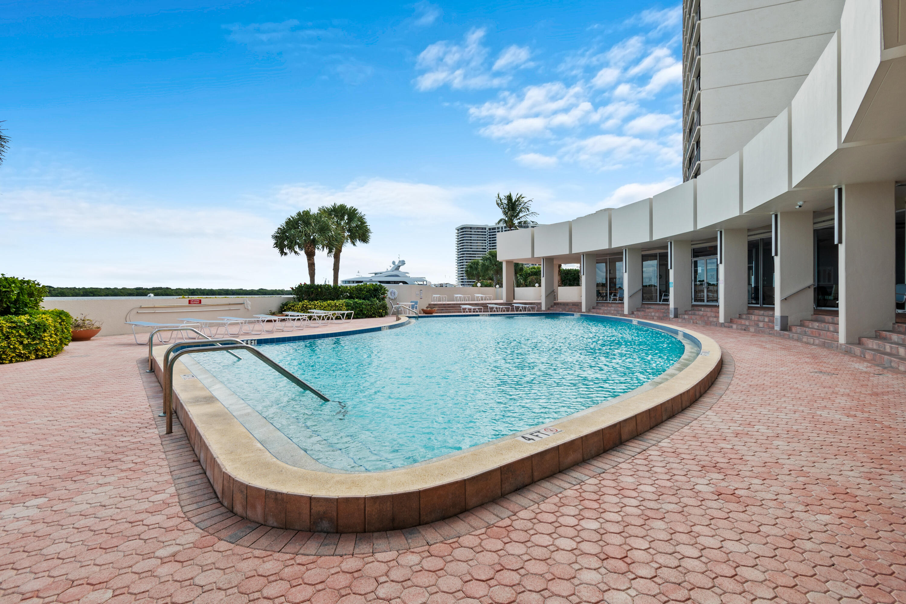 134 Lakeshore Drive, Unit 814 North Palm Beach, FL 33408 - Photo 22 of 30 swimming pool view with a garden space