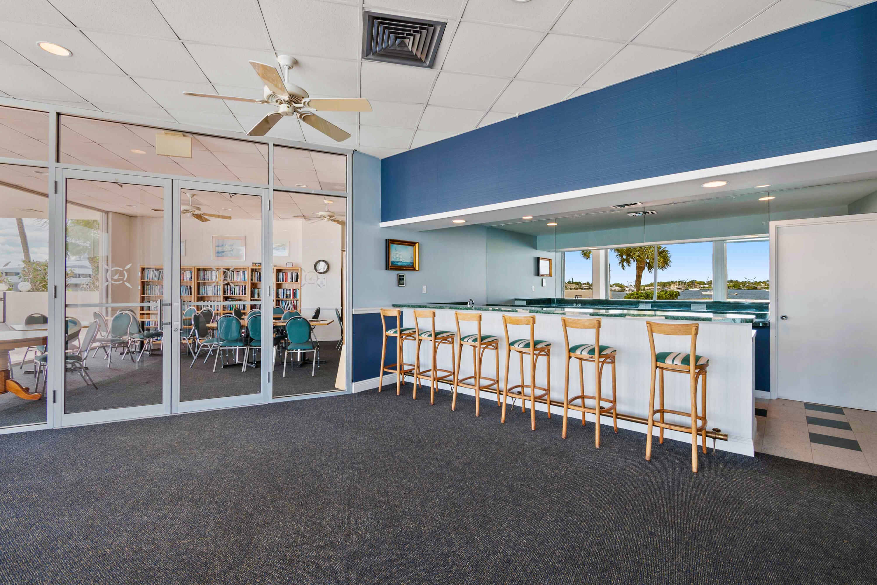 134 Lakeshore Drive, Unit 814 North Palm Beach, FL 33408 - Photo 26 of 30 a storage room with water heater and a wooden floor