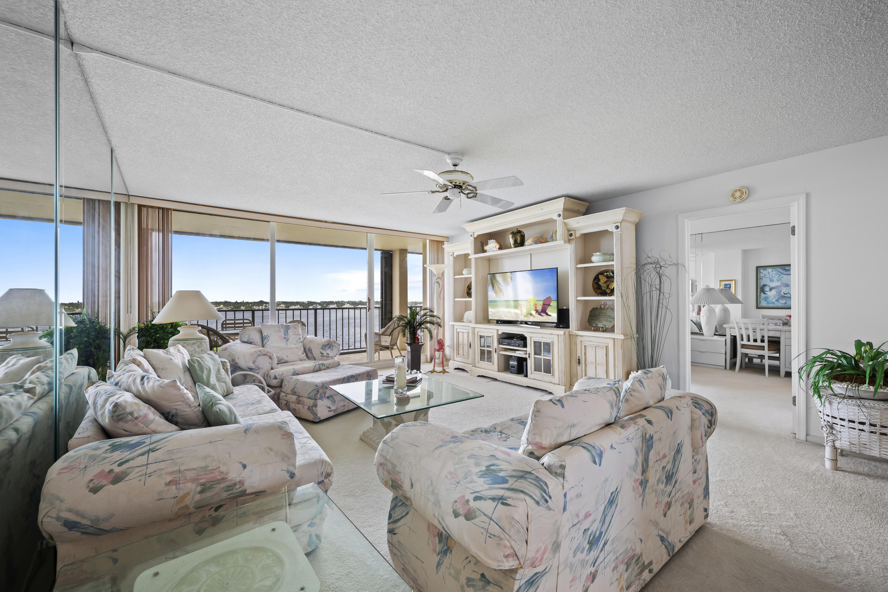 134 Lakeshore Drive, Unit 814 North Palm Beach, FL 33408 - Photo 6 of 30 a living room with furniture and a large window