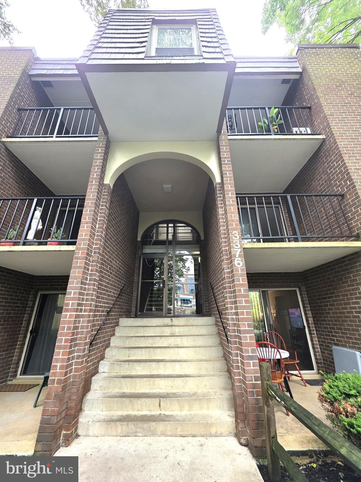 3376 Woodburn Road, Unit 32 Annandale, VA 22003 - Photo 1 of 21 a view of a building with a balcony
