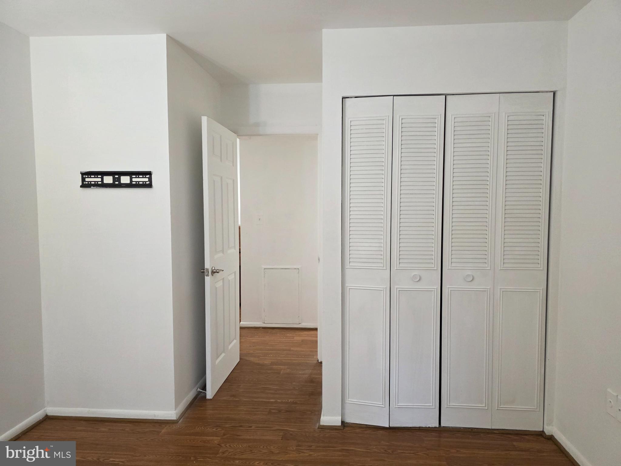 3376 Woodburn Road, Unit 32 Annandale, VA 22003 - Photo 11 of 21 a view of an empty room with wooden floor