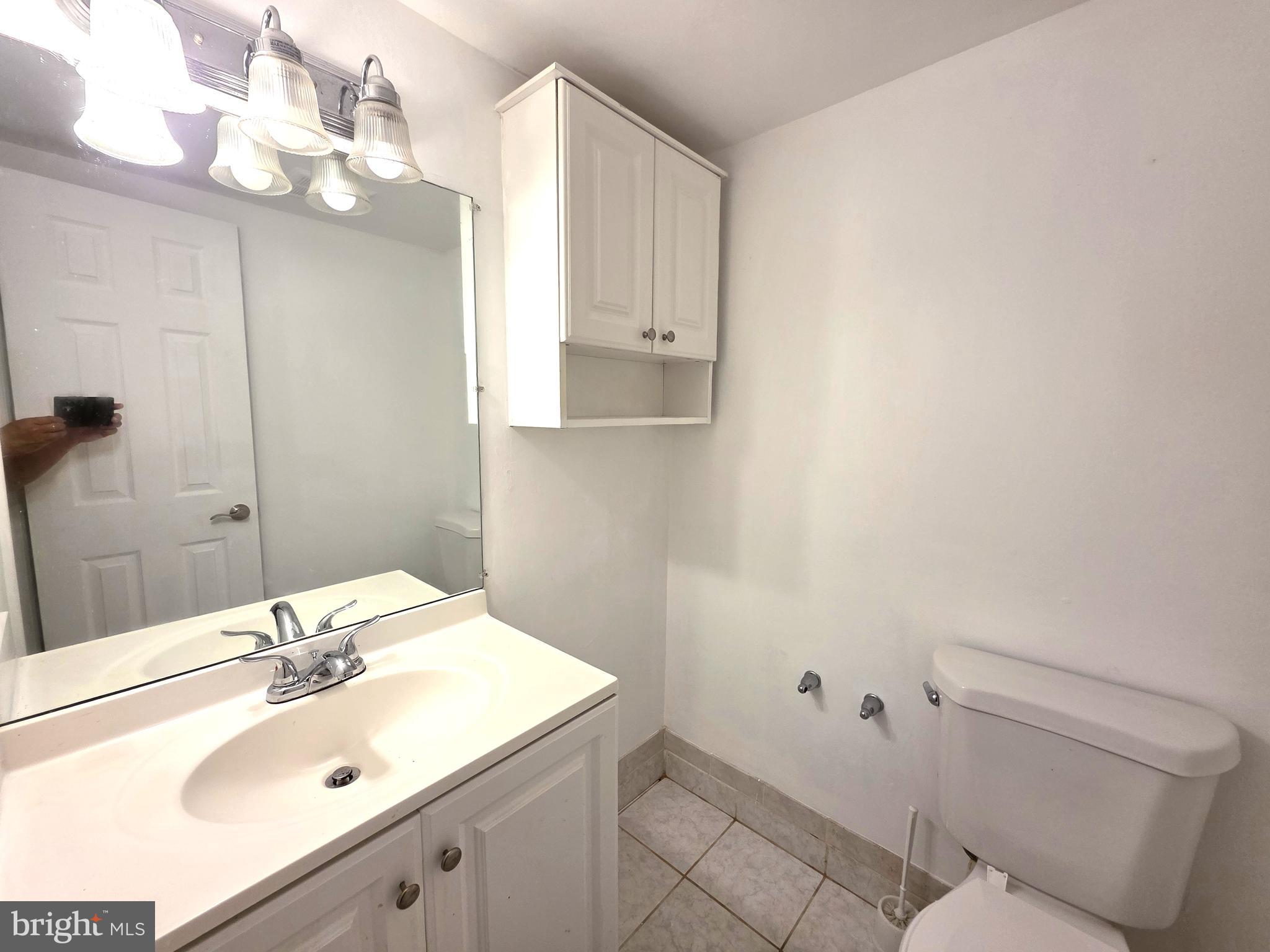 3376 Woodburn Road, Unit 32 Annandale, VA 22003 - Photo 16 of 21 a bathroom with a sink vanity granite and toilet