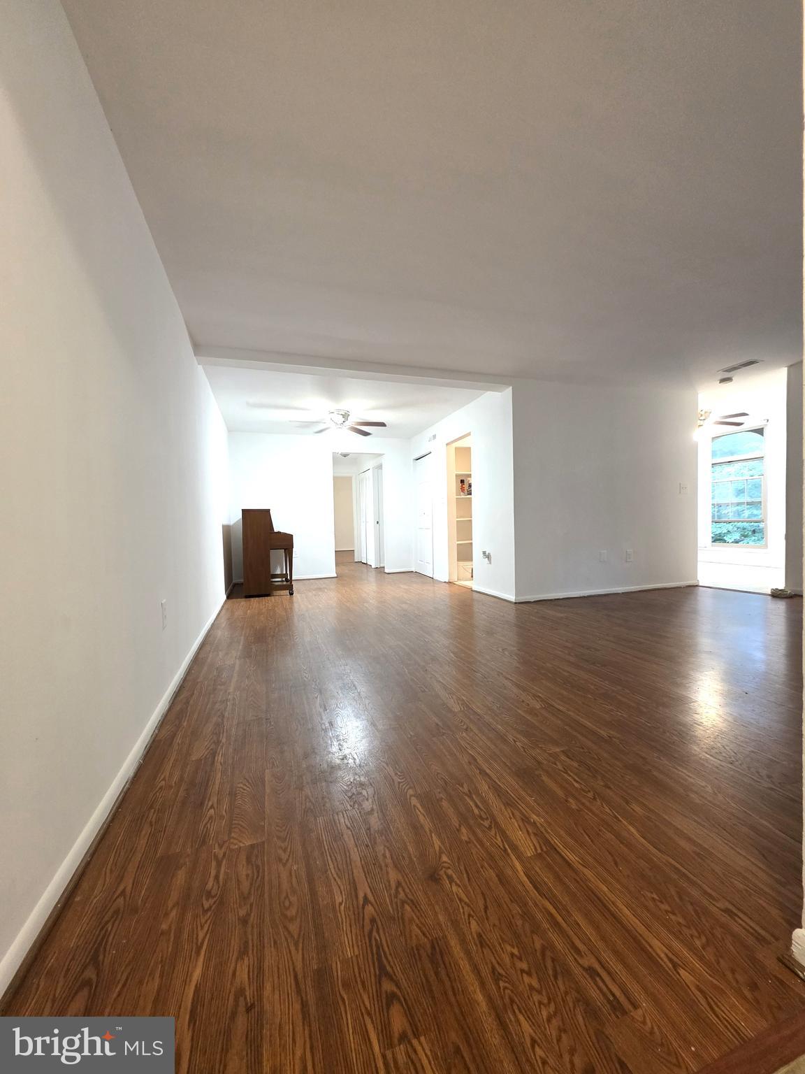 3376 Woodburn Road, Unit 32 Annandale, VA 22003 - Photo 8 of 21 a view of empty room with wooden floor
