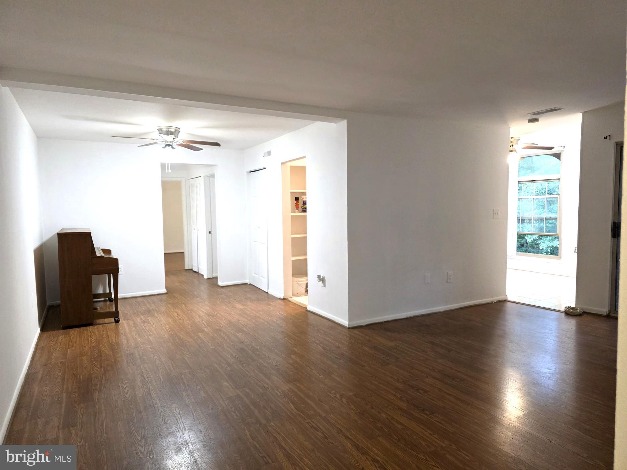 3376 Woodburn Road, Unit 32 Annandale, VA 22003 - Photo 9 of 21 a view of a livingroom with wooden floor and a window