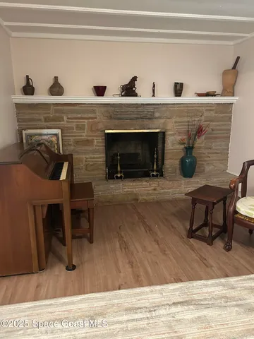 a view of a livingroom with furniture and a fireplace