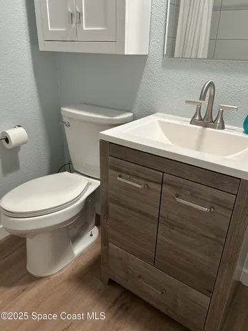 a bathroom with a toilet and a sink