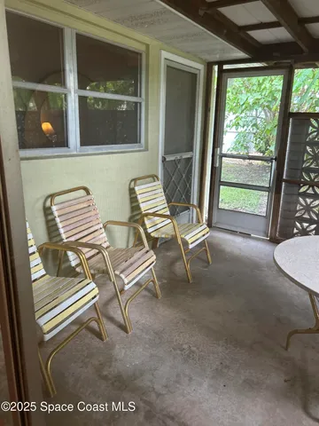 a view of a room with a large window