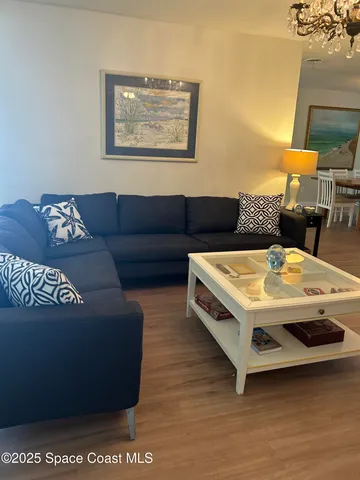 a living room with furniture and a table