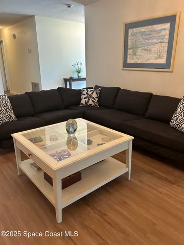 a living room with a bed and a couch