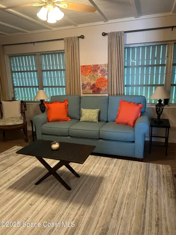 a living room with furniture and a window