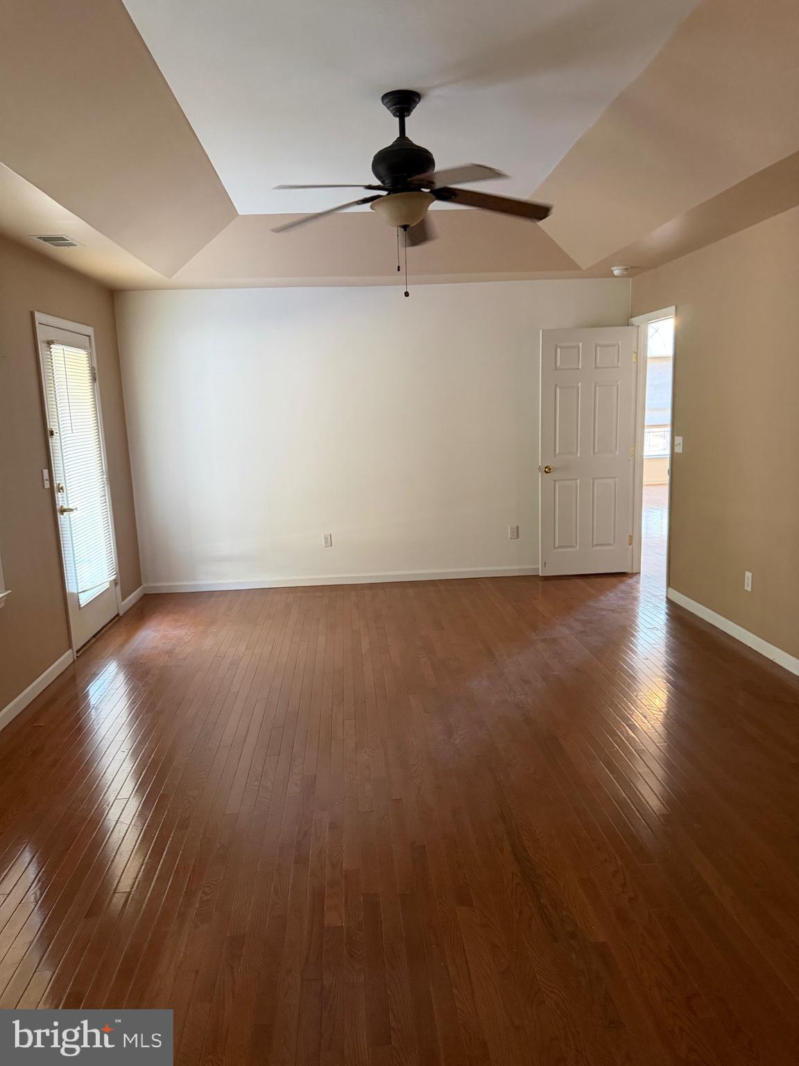 32841 East Riga Drive Ocean View, DE 19970 - Photo 22 of 33 a view of an empty room with wooden floor and a window