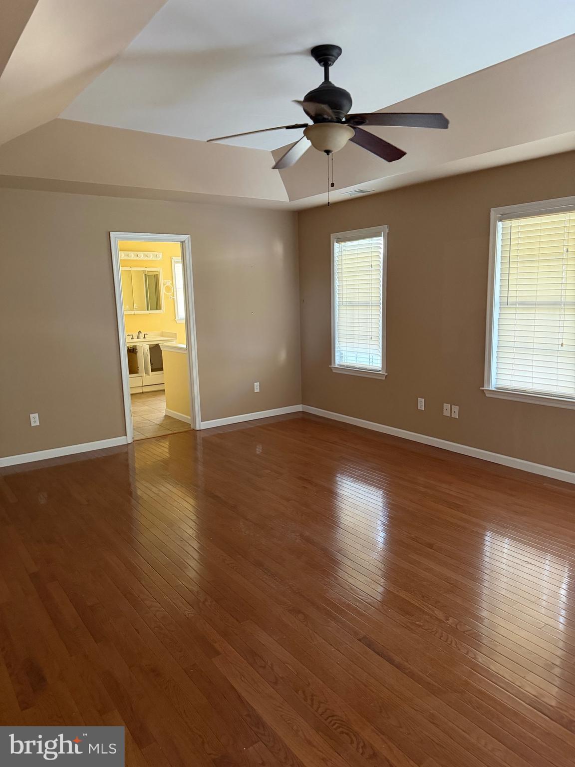 32841 East Riga Drive Ocean View, DE 19970 - Photo 25 of 33 a view of an empty room with wooden floor and a window