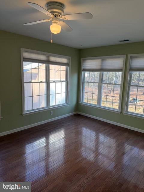 32841 East Riga Drive Ocean View, DE 19970 - Photo 27 of 33 a view of an empty room with wooden floor and a window